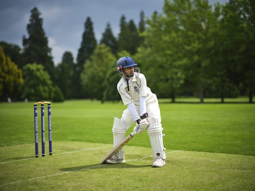 Kimbolton School pupil playing cricket