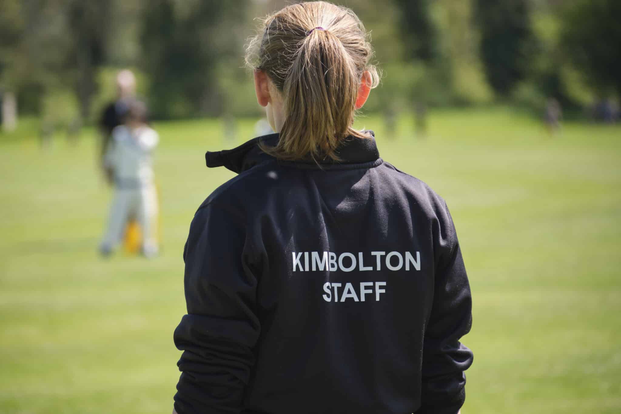 Kimbolton Staff member wearing a jacket, labelled Kimbolton staff