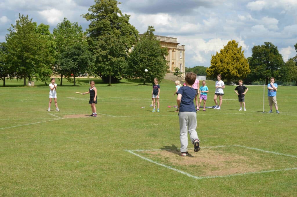 Summer Sports Week at Kimbolton School children playing cricket